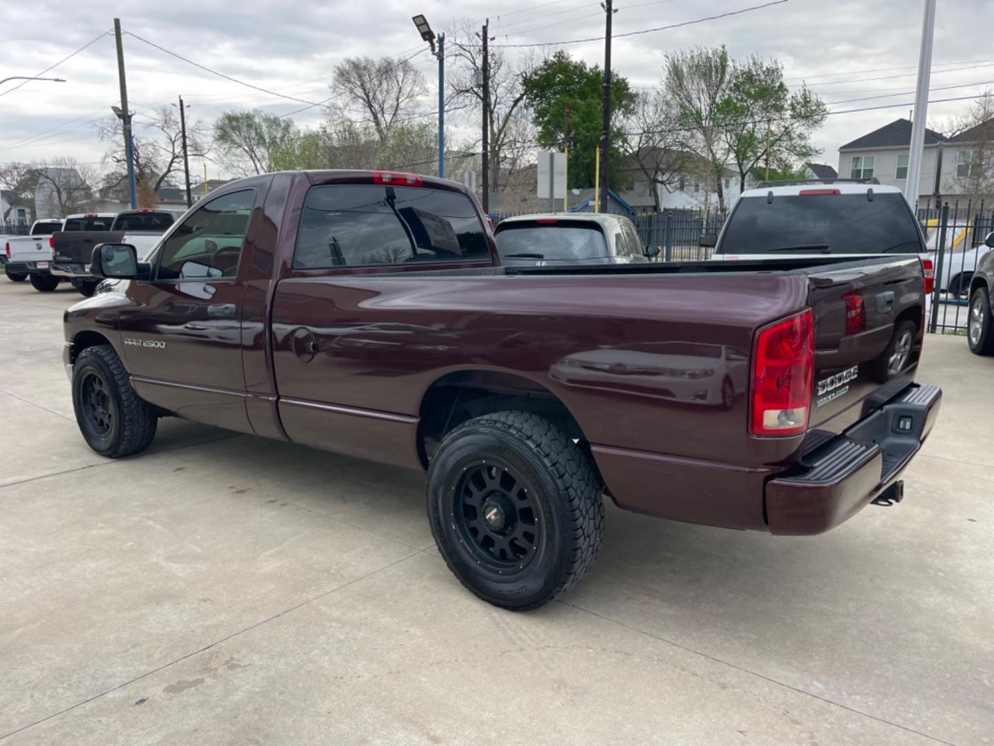 2004 Maroon /Black Dodge Ram 2500 Laramie 2WD (3D7KA26C44G) with an 5.9L L6 OHV 24V TURBO DIESEL engine, Automatic transmission, located at 1501 West 15th St., Houston, 77008, (713) 869-2925, 29.797941, -95.411789 - Photo#3